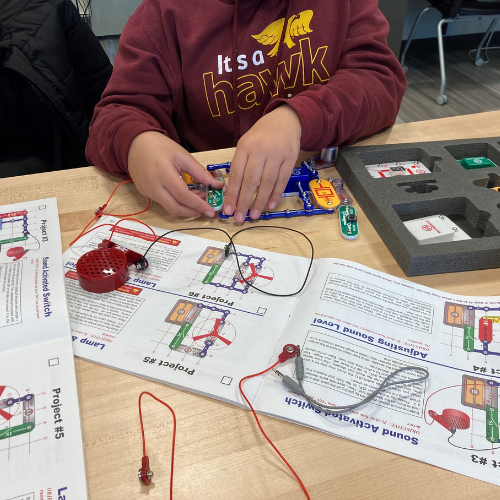 Person playing with Snap Circuits