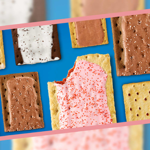 Image of multiple flavors of pop tarts with a strawberry one center and looking like a bite was taken out of it.