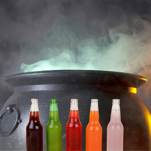 Colorful bottles of pop in front of a smoking cauldron 
