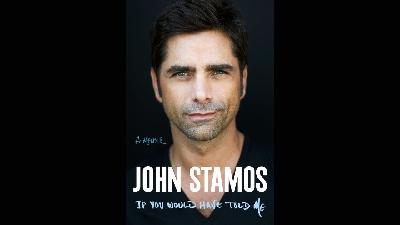Photo of John Stamos against a black background