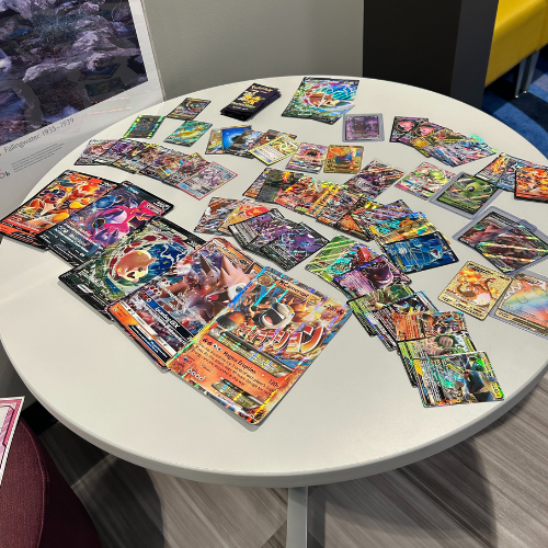 A table covered with Pokémon cards
