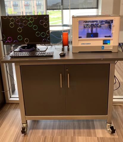 Portable cart with a 3D printer and a computer