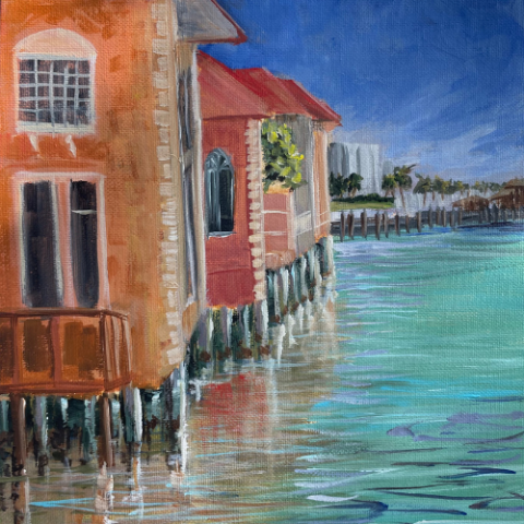 Artwork by Deanne Skokan; image is a painting of orange and red houses on stilts over a blue-green ocean and bright blue sky.