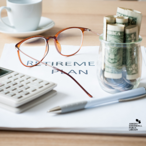 Photo of a document titled Retirement Plan on a wooden table with a calculator, pair of glasses, coffee cup and jar of money on it