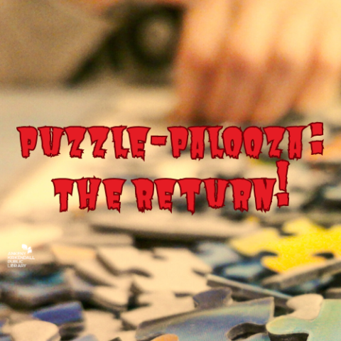 Close up of puzzle pieces and the text "Puzzle-Palooza: The Return" written in red text