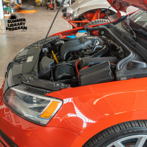 open hood of a red car