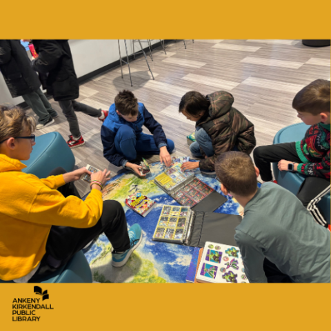 Group of teens trading pokemon cards