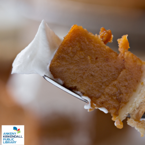 a bite of pumpkin pie with whipped cream