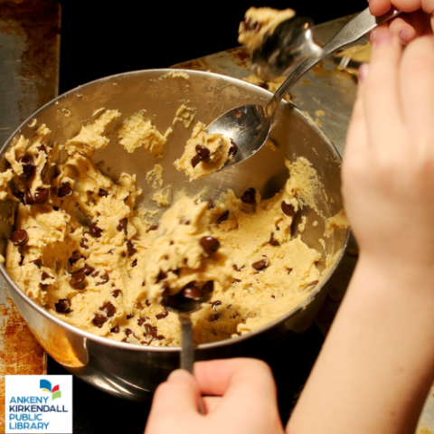 Bowl of cookie dough and three hands holding spoonfuls of cookie dough