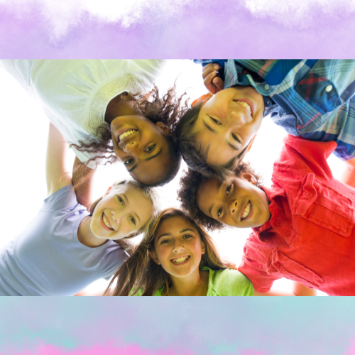 Looking upward at a group of teens facing the camera, with colorful clouds behind them