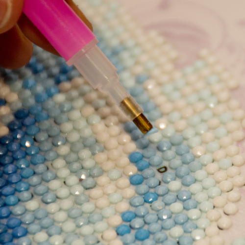 Close up of diamond painting in progress