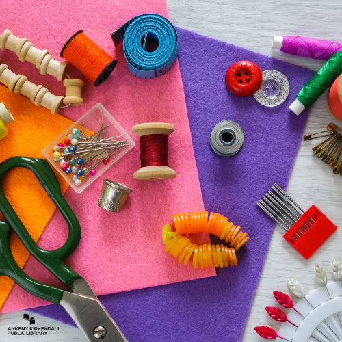 Sewing supplies with fabric, fabric scissors, needles, pins, and thread