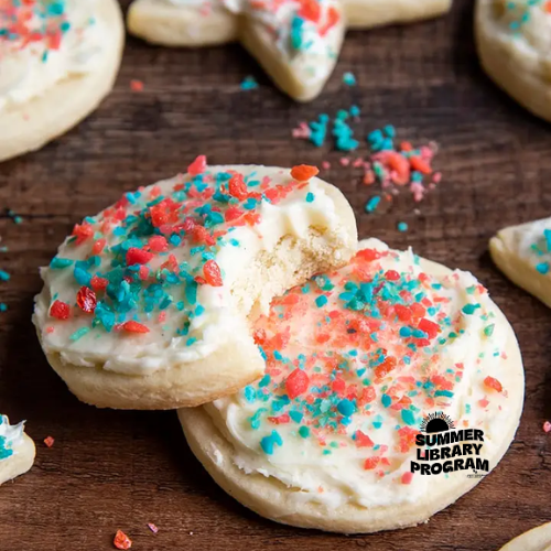 Sugar cookies with frosting and blue and red poprocks on top