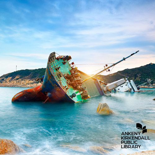 Blue and red ship turned on its side in a blue lagoon