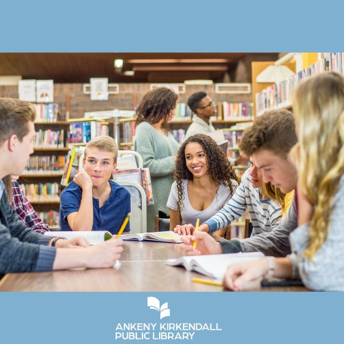Group of teens talking with each other in a library