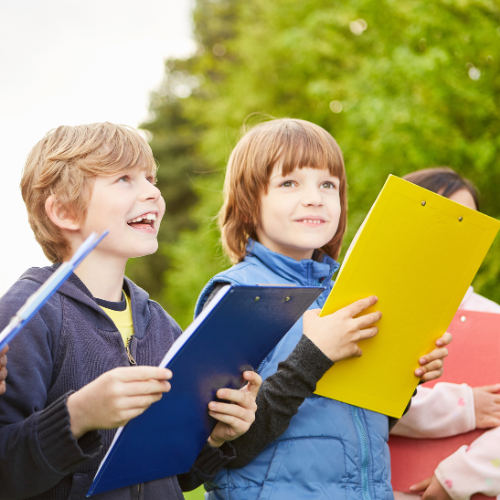 Children look for clues during a treasure hunt.