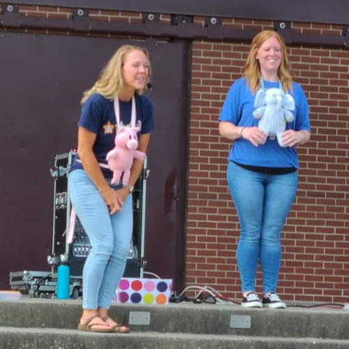 Librarians share a story time about an elephant and a pig. 